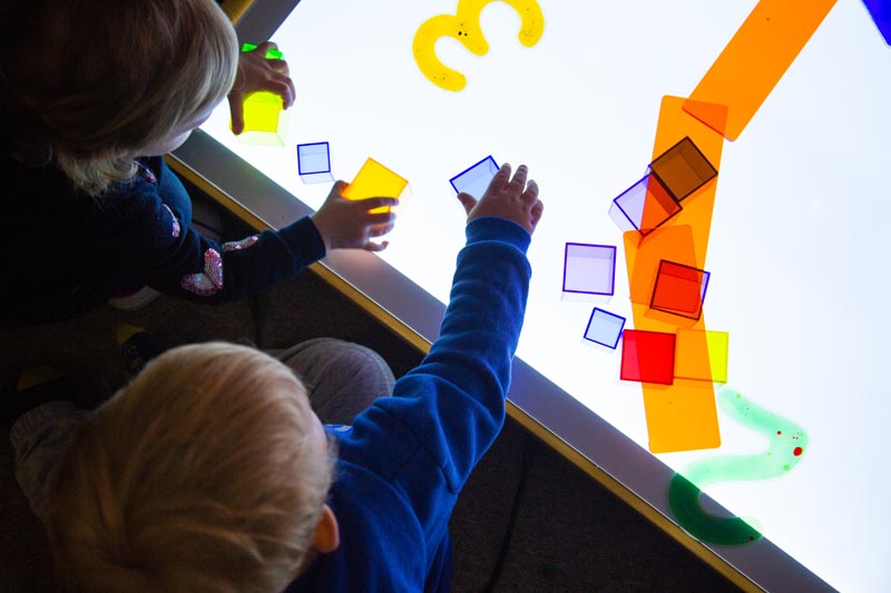 Indoor play with screen and blocks