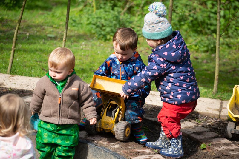 group of children play outdoors