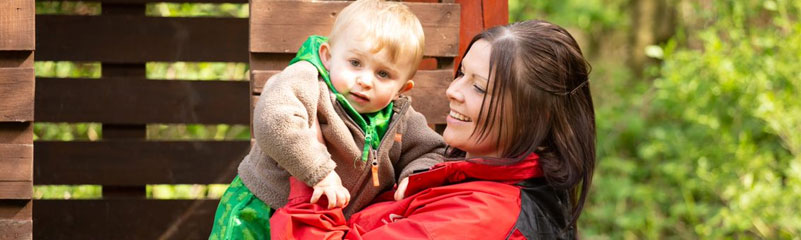 staff member holding child